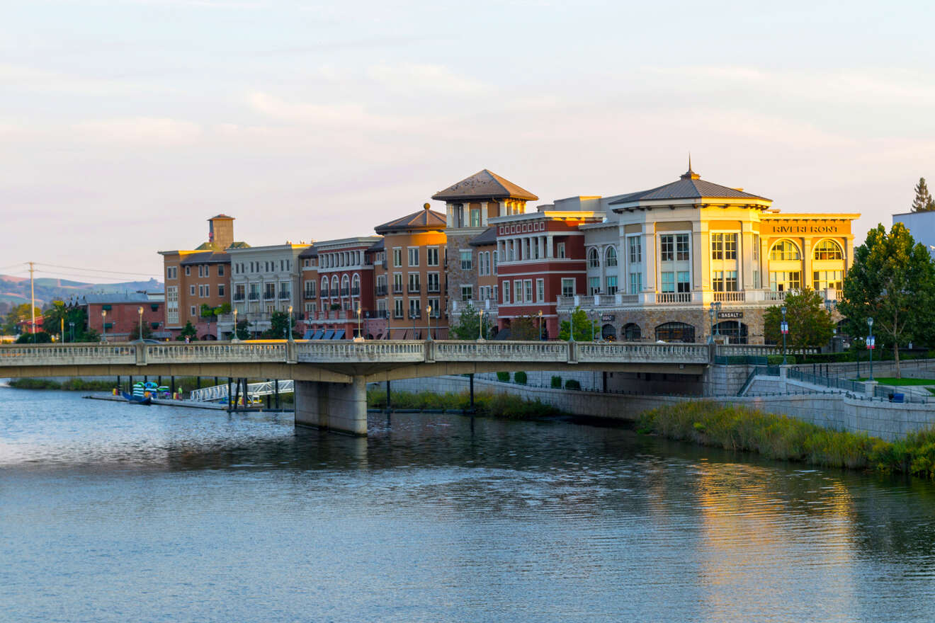 a bridge over a river with buildings on either side of it